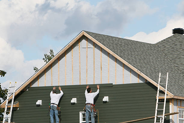 Professional Siding Installation technician working in Newton Center, MA